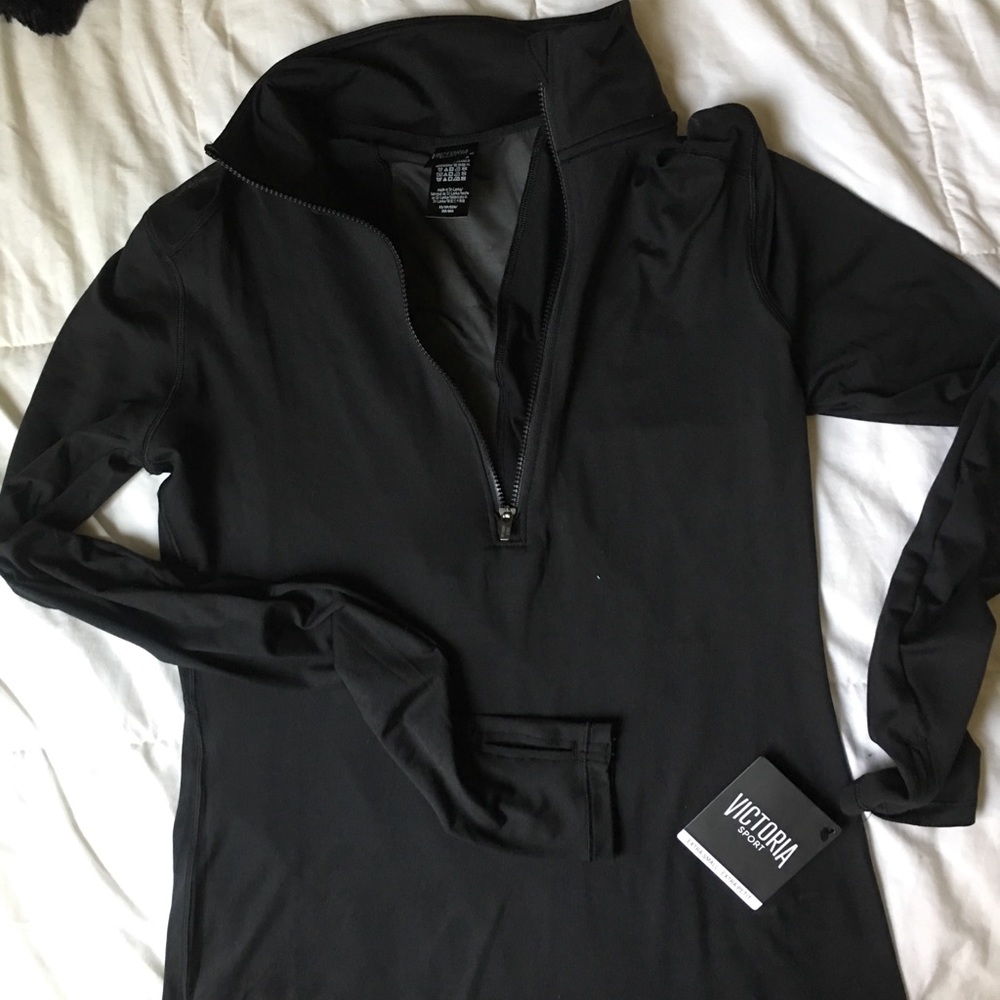 Black half-zip jacket with mesh strip in back